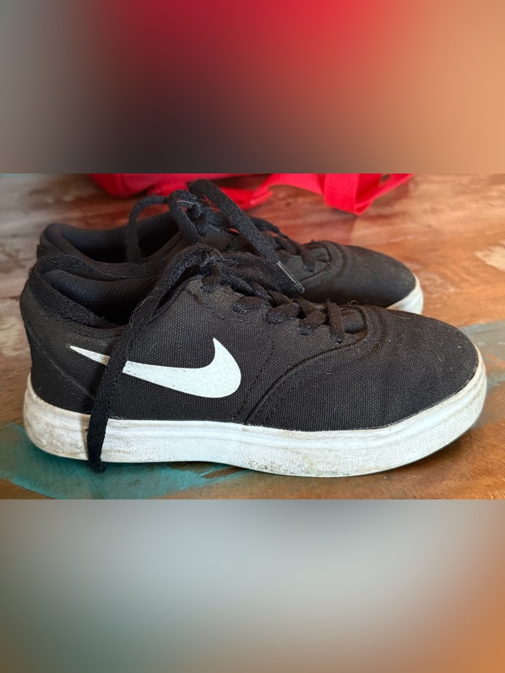 Nike Black Low-Top Kids' Sneakers with White Swoosh Accent